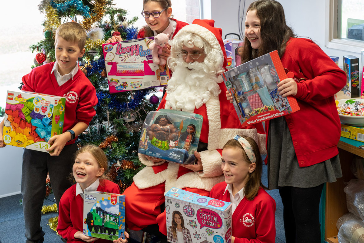 Santa helping children in West Berkshire